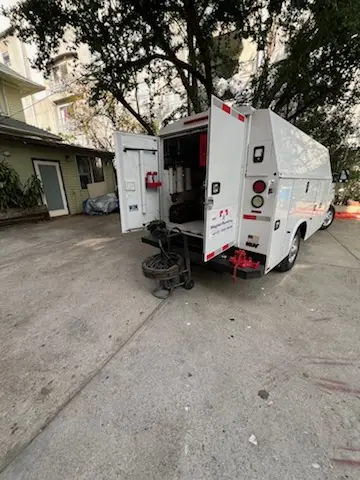 Magnet Plumbing service vehicle on-site for Water Heater Repair in Cumming
